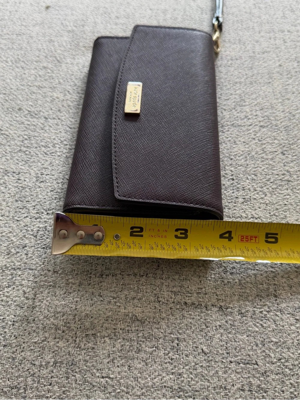 kate spade plum leather wristlet with gold-tone logo